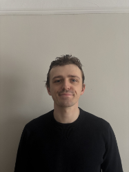 A headshot of Liam Ferguson smiling