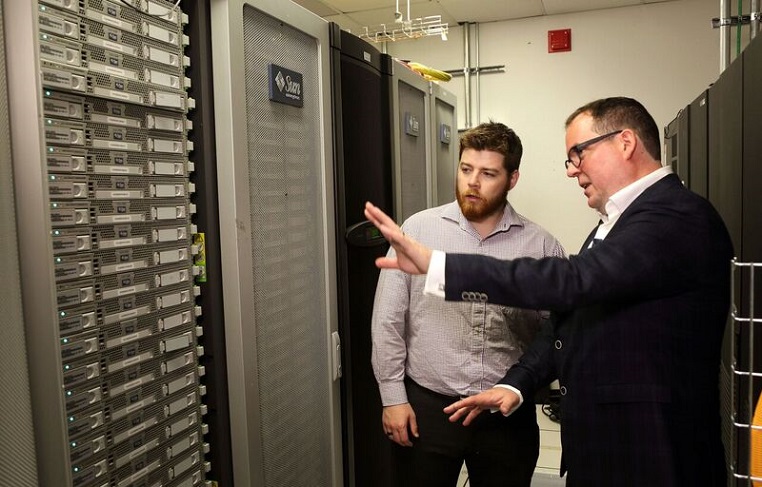 Dr. Jason Rhinelander and Preston Stronach in the computer server room